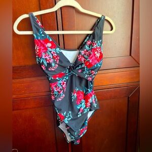 Floral navy one piece swimsuit with ruching at bust /size medium